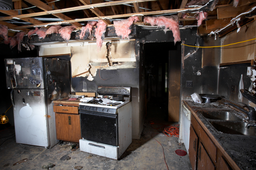 Aftermath of a house fire showing blackened & soot stained kitchen appliances : Fire Safety : Fire Risk Assessments