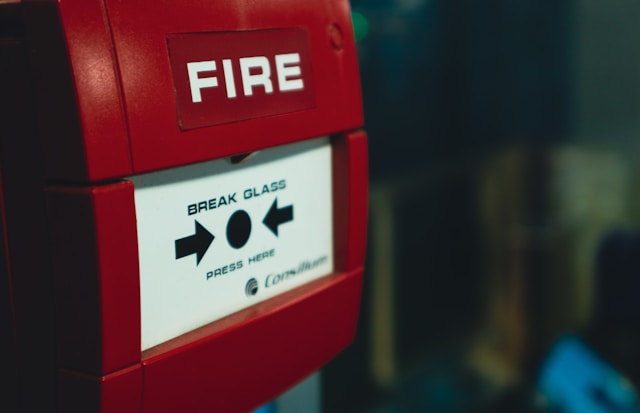 Red fire alarm point : UK Office Fire Risk Assessment.